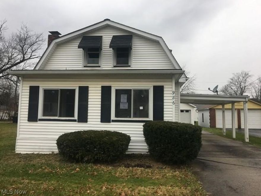 1.5 story home has been well maintained and has enclosed front porch, living room with brick fireplace, dining room with window seat ledge and kitchen on first floor, 3 bedrooms and full bath upstairs, full basement with an open toilet and sink, needs walls to be considered a bathroom, 2 car detached garage and a carport that extends from the house over the driveway.