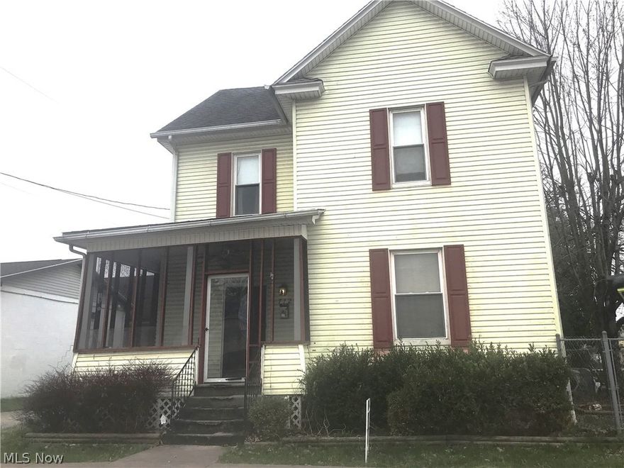 Great investment opportunity. This solid older home provides an enclosed front porch, fenced back yard, alley access and 3 stall garages. With a little love this home could be brought back to its original luster.
