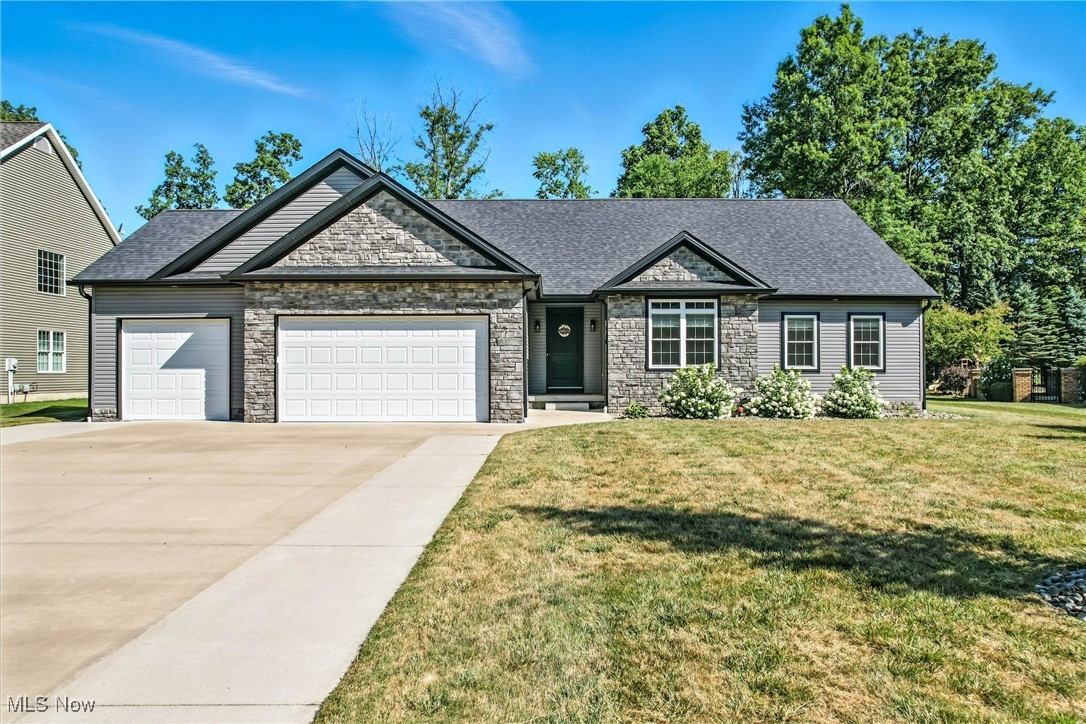 Welcome to this stunning 3-bedroom, 3-bathroom ranch-style home. Built in 2020, this residence blends comfort, functionality, and style with desirable features throughout. Upon entering, you're greeted by a welcoming foyer that opens to a light-filled great room featuring cathedral ceilings, LTV flooring, a cozy gas fireplace, and tasteful window treatments. The open-concept layout flows seamlessly into the expansive eat-in kitchen, also boasting cathedral ceilings, granite countertops, and LVT flooring. A walk-in pantry provides ample storage, while the large center island and generous dining area make this the perfect space for both casual meals and entertaining guests. The home features three generously sized bedrooms on the main level, each with plush carpeting and custom window treatments. The spacious primary suite includes a master bathroom with dual vanities and a walk-in closet. Two additional bedrooms on the main level share access to a full bath with updated finishes. Downstairs, the fully finished basement adds living space with a large bonus room, a recreation room, a 4th bedroom, and a full bathroom. There's also a separate office, ideal for working from home, and ample storage throughout. Convenient main-level laundry, a 3-car attached garage with electric and water access, and additional utility features like a sump pump and 2 50-gallon hot water tanks, provide peace of mind and ease of living. The home is equipped with forced-air gas heating, central air conditioning, and ceiling fans for year-round comfort. Exterior features include a welcoming front porch and a back patio perfect for outdoor relaxation. Located in a desirable area and constructed with quality craftsmanship, this ranch home is move-in ready and ideal for families or those looking for single-floor living with bonus basement space. Don't miss this opportunity to own a beautifully designed and meticulously cared-for home with all the modern features you're looking for.