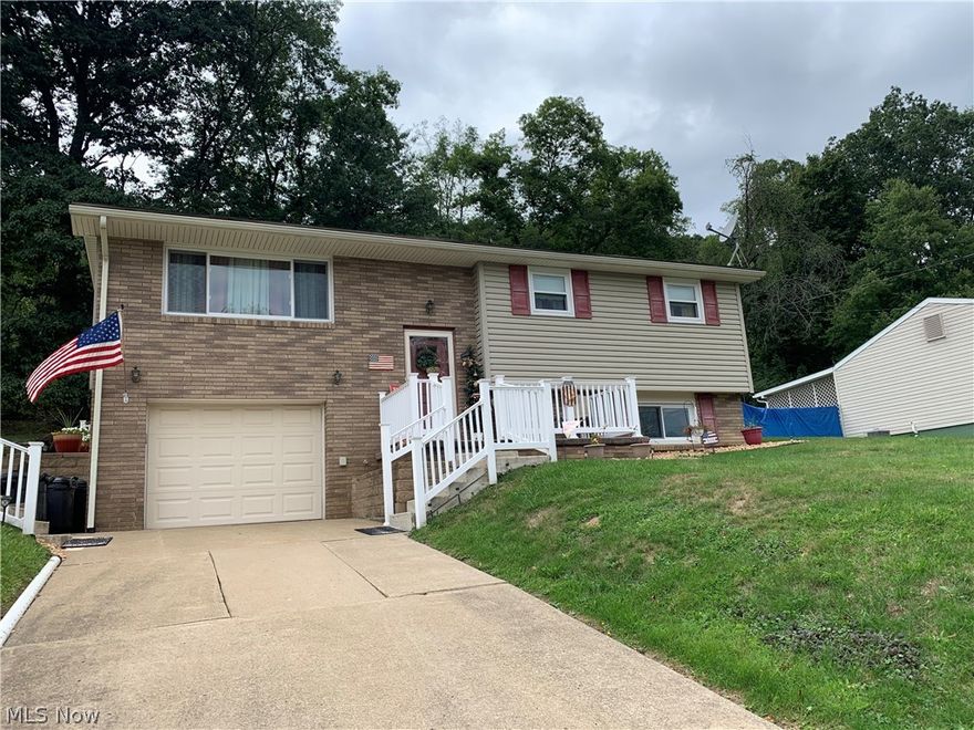 Move in ready split-level home with 3 bedrooms and a full bath on the main floor. Basement has a finished rec-room with a bar. Another full bath in the basement with large shower. Covered back porch with newer railing. New front door to be installed.