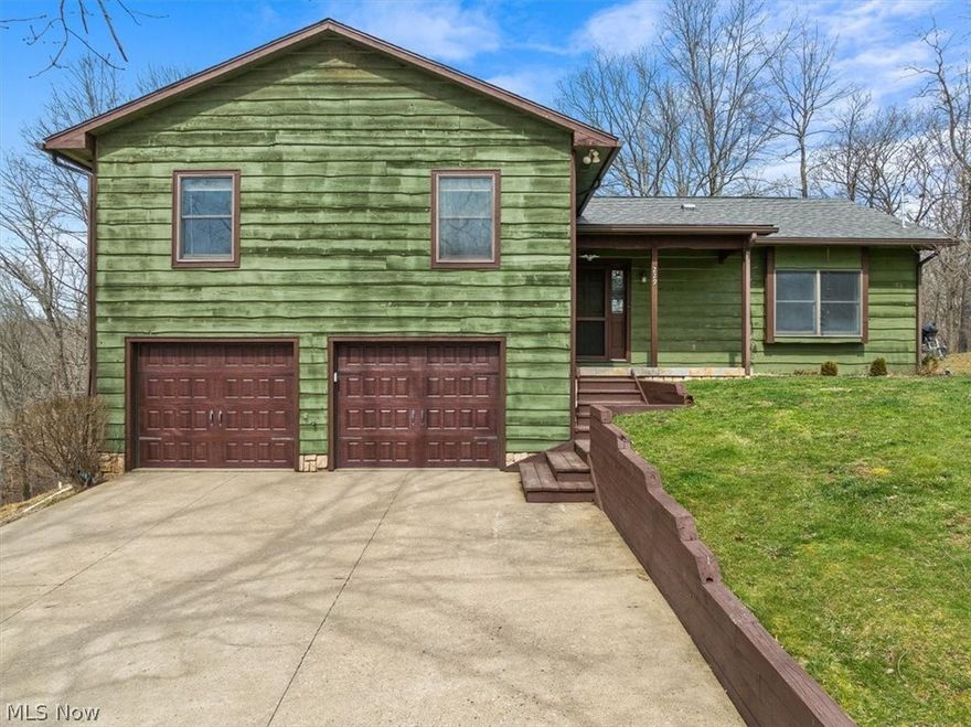 All Cedar multi level open floor plan on .67 acre park like setting. This well maintained home offers handsome hardwood pegged flooring, beamed volume ceilings and an abundance of nature and light throughout. The great room is the heart of the home with center island designed kitchen, solid oak cabinetry, stainless appliances and raised deck for dining with private wooded back. Lower level fireside family room and laundry center. Double garage with carriage house style doors and detached 10 by 24 floored storage building. Good move in condition and available for immediate possession.