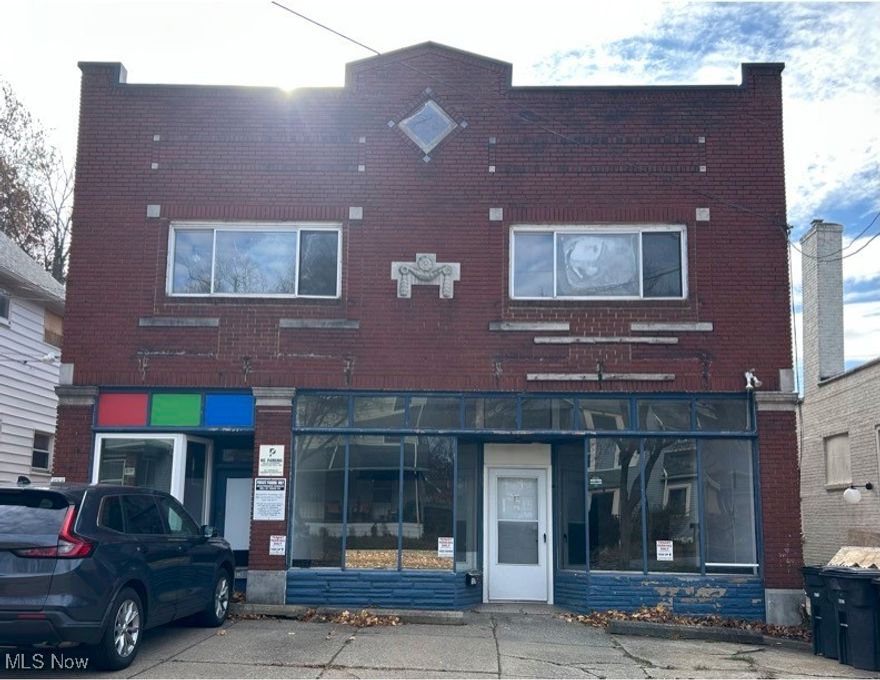 This versatile 2,000 square foot commercial storefront is located on the first floor of a charming historic four-unit building. The space offers an open, flexible room that's perfect for a studio, office, gallery, or small retail business. There's two separate rooms and a kitchenette with a refrigerator, stove and sink. Keep or remove depending on your needs.  There is also a private bathroom to provide convenience for your staff and customers. A huge recently cleaned-out basement is available for extra storage.  Extra Large front windows bring in a ton of natural light and offer excellent street visibility, while high ceilings add to the open feel.  The unit's layout makes it easy to customize for a variety of business needs. This property is conveniently situated on a quiet street just minute from Highland Square Theartre, Mustard Seed Market and House Three Thirty.The location offers both neighborhood charm and proximity to downtown Akron. Tenants enjoy a dedicated parking spot directly in front of building and there's free street parking on Jefferson Ave. Additional parking in large lot behind building is available for rent if needed.