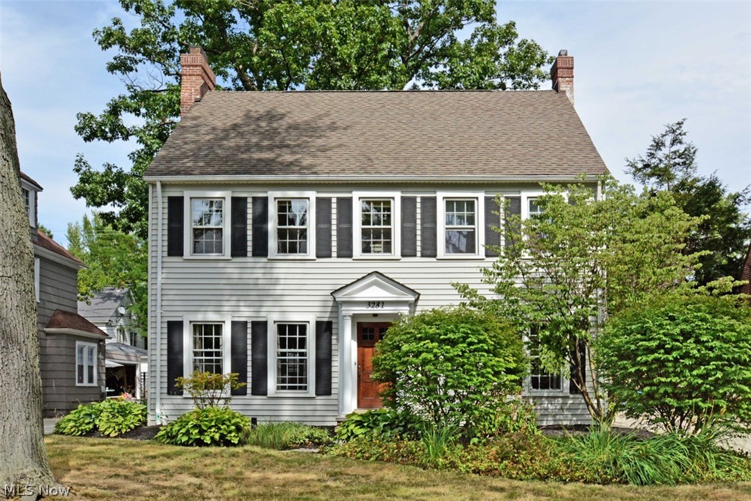 Light, bright Fernway colonial. Today's decor and updates and beautiful architectural detail! First floor with great flow includes spacious living room with feature fireplace and french doors to patio; formal dining room with built in china cabinets; updated eat-in kitchen with granite countertops and stainless steel appliances; and convenient mudroom. Second floor has three spacious bedrooms, an updated hallway bath and a master bedroom with private updated master bath with large shower (added by current owners)! The third floor suite is fantastic with skylights, lots of storage and a private bath -- great for teens, guests or nannies! Mature, professional landscaping. Nice, private fenced-in backyard with lovely patio garden. Lots of updates including newer concrete driveway, new front porch and pillars, updated electrical, rebuilt chimneys. Move in and enjoy the neighborhood. Fabulous location -- rapid at the end of the block, great commute to universities, hospitals, University Cir