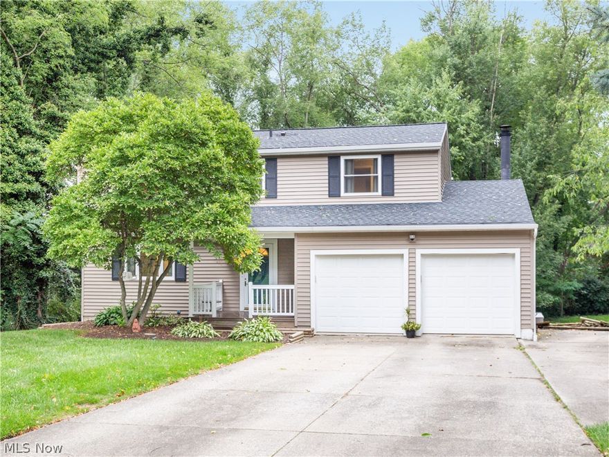 There is pride of ownership at this 4 bedroom 2.5 bath colonial in Munroe Falls. The first level has a living room and formal dining room as well as an open kitchen and family room.  The kitchen has been updated and offers stainless steel LG appliances. Enjoy the family room with wood burning fireplace as well as sliders to the deck. The half bath on the first level was updated in 2015. The second level features 4 bedrooms a full updated bath. The master bathroom has been updated with a walk in shower and closet. The basement is a walkout and is finished with a 22X14 rec room. The unfinished area in the basement is perfect for storage. New windows 2011. The roof, deck, vinyl siding, and front porch were done in 2016. The lot is 95x175. Home warranty is provided. The additional square footage is the walkout basement