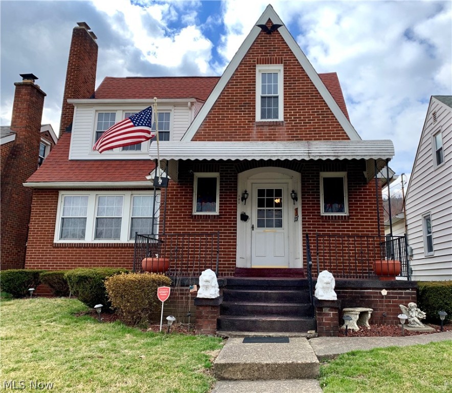This spacious, Brick Cape Cod is the affordable home you've been waiting for! Maintenance-free brick exterior, beautiful upgraded replacement windows and newer roof shingles. Huge, detached carport with concrete parking pad, which also would make the perfect covered patio area, and ALSO a one car detached garage. Storage galore in this home, including 2 large walk-in closets on the main level. Spacious living room with fireplace (gas line is present, but needs connected to gas logs. Current logs are decorative, only). Pull up the carpets in the living room and bedrooms to expose the hardwood floors! (The carpet edge has been released so that you can take a peek!) Lovely dining room has built-ins to store your favorite glassware. The dining room leads to the fully equipped kitchen where there is ample cupboard space and you will enjoy cooking with your gas stove. The kitchen also features built-ins that would provide the perfect location for a coffee bar. Plenty of space for everyone t