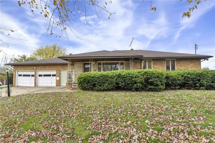 Prepare to be Moved! Welcome Home... to this spacious 4-side brick home in western Lorain on an expansive corner lot!  Step up to your welcoming front porch before entering into the spacious living area with slate fireplace that opens to a dining area that is connected to an eat-in kitchen. You will also find 3 bedrooms with wood floors, a full bath and a second living area that opens to both the front and back yard on the main level.  Double your square footage with a spacious full basement offering space for a large rec room, two separate office or flex spaces, a full kitchen, plenty of storage and a second full bath. Bring your ideas and creativity to this home to restore it back to its original beauty. It is loaded with potential! Close to major highways, shopping, restaurants, churches, schools and so much more. If you are looking for an incredible value, don't miss out. Schedule your showing today! Seller offering a home warranty!
