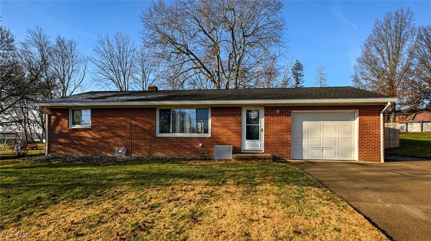 What better way to celebrate the new year, than making this charming ranch your new home!  Located in a prime spot on the southwest side of Massillon.  Only 5 minutes to downtown, 7 minutes to the Massillon Marketplace (Walmart, Lowes, Starbucks, ect) and in the Tuslaw school district!  Not only do you get a solid brick ranch, it sits on over a half acre lot too!  The incredible back yard has recently been fenced in with high quality cedar wood and a gate on either side.  There is extended parking along side the garage, a paver patio area and firepit.  Also added in the last couple of years is a sliding door off of the dining area, to provide access to the wonderful new back deck!  Inside you will be pleased to see the entire home has been updated with durable LVP flooring.  The great layout makes the 864 square feet seem like so much more!  Starting with a spacious and bright living room that opens to the large eat-in kitchen.  Well equipped with lots of counter/storage space and including the gas range, fridge and dishwasher, the kitchen has all you need!  Down the hall, in fantastic shape, you will find the full bathroom and the two very comfortable bedrooms.  Down stairs is an opportunity to nearly double your usable square footage!  This amazing basement is begging to be finished, but is clean, dry and super usable just as is.  Currently set with a work bench, laundry table, a wall full of storage shelving and a bonus second shower!  Basement is waterproofed, has glass block windows with vents and wells outside and the newer washer/dryer will stay too!  There is still the attached garage, with a man door to the back and outfitted with three walls of peg board to keep all your tools organized and neat!  Don't regret letting this one pass you by.  CALL FOR YOUR PRIVATE SHOWING TODAY!