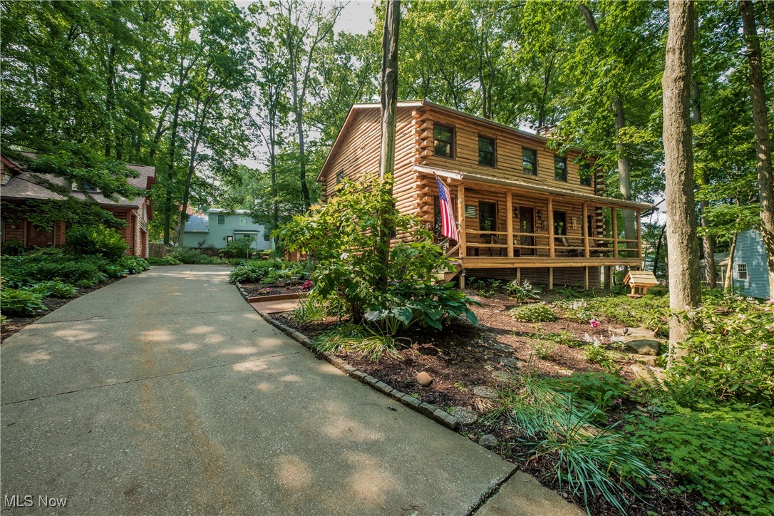 Welcome to 5820 Kildare Circle NW in the heart of Jackson Township. This secluded 4 bedroom, 4 bath log home sits on .85 acres (2 parcels). It offers a unique blend of rustic charm and timeless appeal, combining natural beauty with solid craftsmanship. The home has so much to offer. A large eat in kitchen with gorgeous granite countertops, and plenty of cabinet storage. The spacious family room offers a cozy fireplace and a warm aesthetic appeal. Several more features include a living room with crown molding, dining room with bookshelves, a partially finished lower level with a woodburning stove, an oversized two car garage, and a deck for those evenings to relax. The .85 acres this property sits on is surrounded with tons of beautiful perennials with landscape lighting. The big plus with this property is a huge detached building that can be used as a garage or for storage. The detached building also has a loft area for more storage. This log home has a warm inviting atmosphere and a sense of connection with nature. Call your favorite realtor and schedule your showing. Seller is negotiable; make an offer.