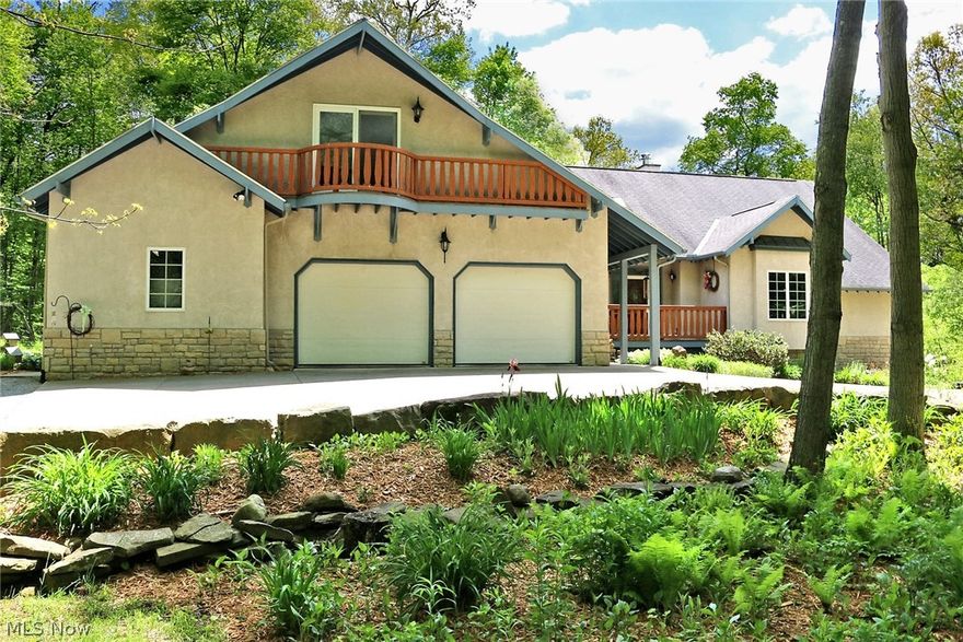 Recently updated spacious Swiss Tudor home located on 3.8 wooded acres. This one of a kind custom built home is perfectly situated in the trees allowing you the opportunity to relax and enjoy Mother Nature! The home features beautifully handcrafted woodwork, a remodeled luxury kitchen with granite counters and stainless steel appliances.  The open floor plan is complimented by the large rooms, high ceilings, picture windows, and 4 bedrooms, 4 bathrooms in Triway School District.  A Dream workshop in the lower level with double door that provides access to the outside. If you need additional space there is a 30 x 45 building with overhead doors for all of your hobbies.