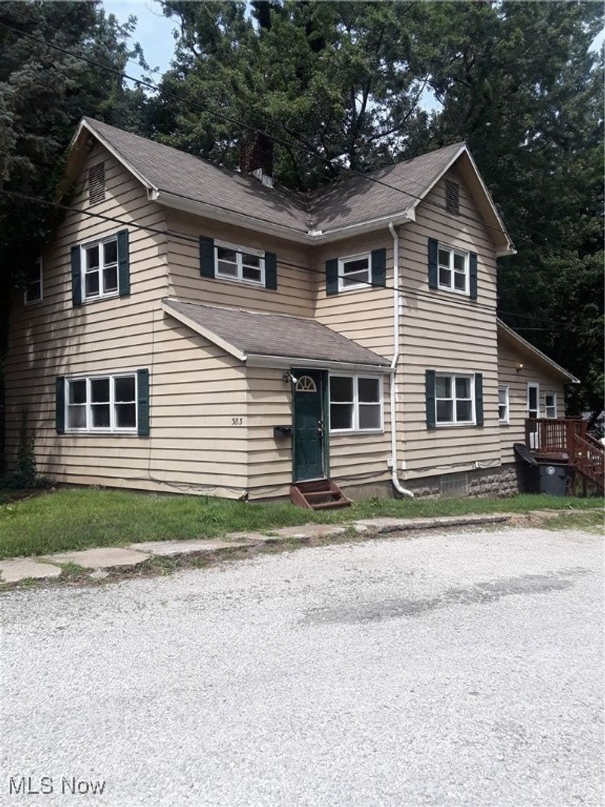 Great starter home or investment property. Located close to Highland Square area. Main floor features laundry hook up, living room, dining room, kitchen and a bonus room with private entry, half bath and walk out patio. Upstairs you will find 3 bedrooms and 2 full bathrooms. Second bathroom is off of the master. Call or click to schedule your showing today!