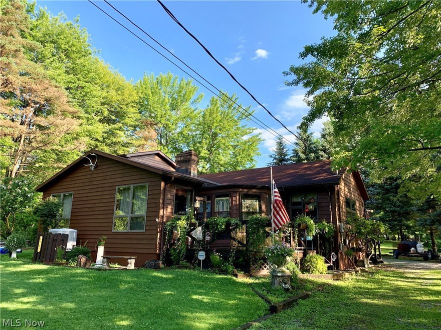 Owner has his own dock on Pymatuning Lake.  Permit is transferable to new owner with yearly fee of $350.00.  Room for 2 boats. Beautiful lodge type home on double lot.  Ideal for lake community living. Wood burning fireplace, some wood cathedral ceilings and new kitchen.  Hot tub stays