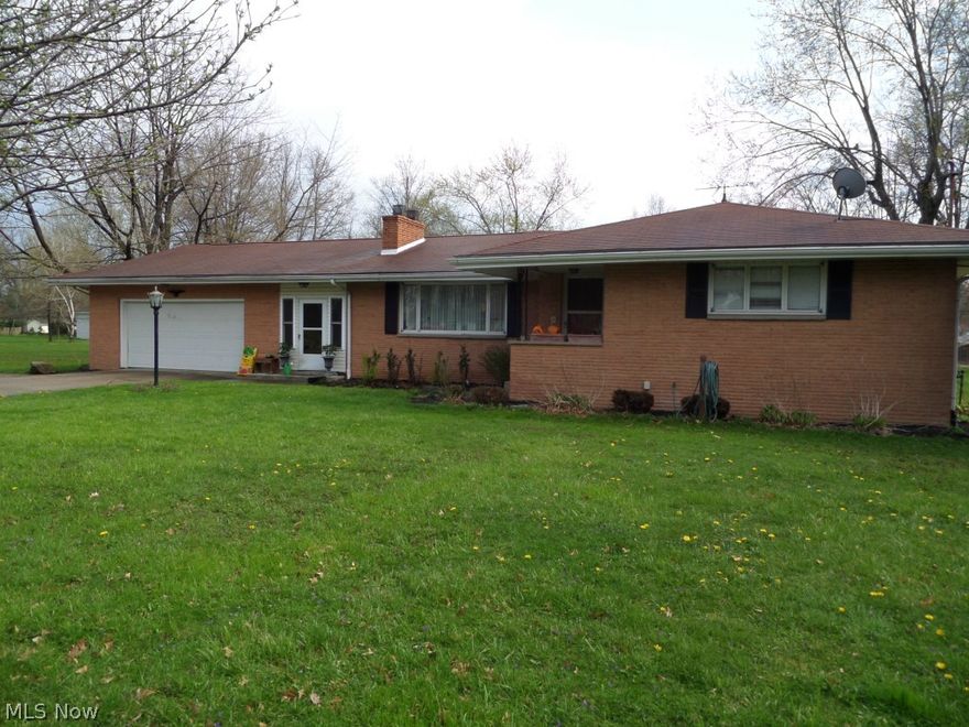 Howland brick ranch on 1.6 acre lot with 4 bedrooms, 2 full baths, 1 half bath, large country kitchen with eating area, huge living room with fireplace and hardwood floors, addition with family room with vaulted ceiling and fireplace and large private 4th bedrooms.  Attached 2-Car garage and large barn.  Covered patio, above-ground pool.  New furnace.  Budget gas bill only $23 per month.  Gas well on back of property.