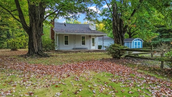 Discover the charm of country living with this 1,224 sq ft home nestled in the trees far back from the road. Natural stone landscaping leads you to a large front porch perfect for enjoying your morning coffee. The main floor greets you with a spacious living room featuring a beautiful brick fireplace and natural wood beam mantel. Continue into the eat-in kitchen which leads to an office, the first bedroom, and the updated bathroom. Upstairs, you'll find the primary bedroom with new laminate flooring, built-in drawers and recessed lighting. New windows throughout allow natural light to filter in.
Just off the kitchen is the large 2 car garage with workbench and access to the full basement and laundry. Also included is a 3rd garage door leading to the back of the property for ease of access and lawn equipment entry. Two sheds are available for additional storage and the greenhouse helps you get your plants started while there's snow on the ground. Walk back to the stunning creek and wooded oasis that make up the rest of the property. Mature pine offers privacy with plenty of open space. There’s room for gardening, outdoor activities, entertaining or even future expansion.
Only a mile from St Rt 11, this house is close to everything from shopping to desired Lakeview schools. Trails, playgrounds, boating, and fishing are also nearby with the Mosquito Lake State Park just minutes away. Make this retreat your own today!
Updates include newer windows, newer hot water tank, newer oil furnace, newer front garage doors, newer siding. Survey has been done and markers are in place. Creek is behind house in about the middle of the property. Shed by the garage + shed and greenhouse behind the house.