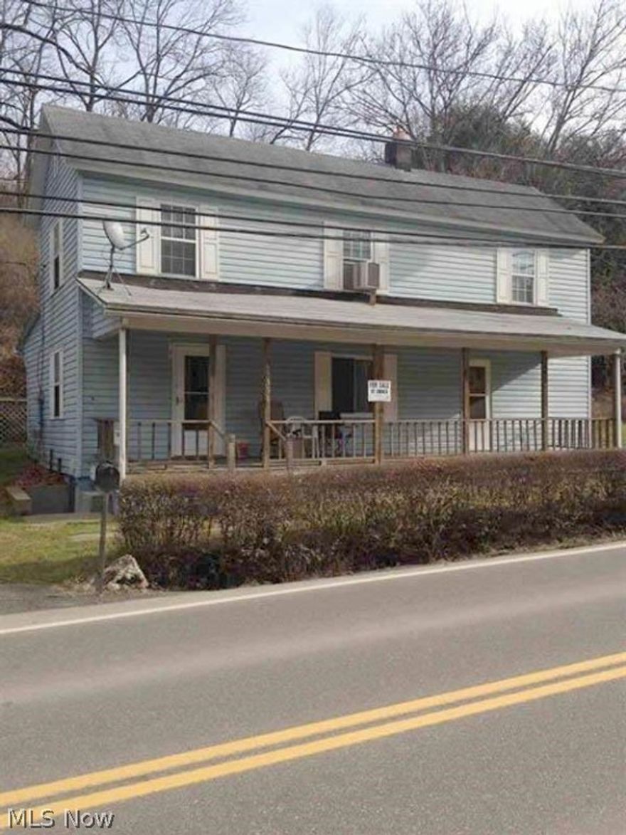 CLEAN! MAINTENANCE FREE!  Updates galore!  Updated kitchen with all appliances, furnace and water heater 7 years old, new poured concrete basement walk out stairs, new doors, appliances remain. Move right into this budget-friendly home!  Current owner uses it as a four bedroom with main floor bedroom (has closet) and also captive bedroom upstairs (has closet) -can be easily four bedroom usage instead of two!  Backyard wooded and backs to National Roadway Bike Trail in the back yard atop hill.  3 Garages!!