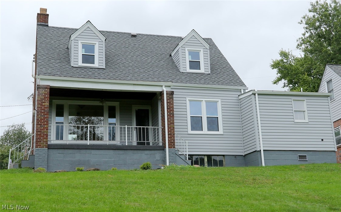 Completely remodeled home with tons of "new". New gas furnace, hot water tank, roof, siding, windows, plumbing, flooring, kitchen with all new cabinets and countertop, new bath on both floors, new garage door and opener, includes a radon gas system, wiring updated. Full basement with crawl space under first floor bath. Access to basement from both inside and out, one car garage, Beautiful view from back porch, close to Martins Ferry schools, hospital, shopping and highway. Ready to move right in.