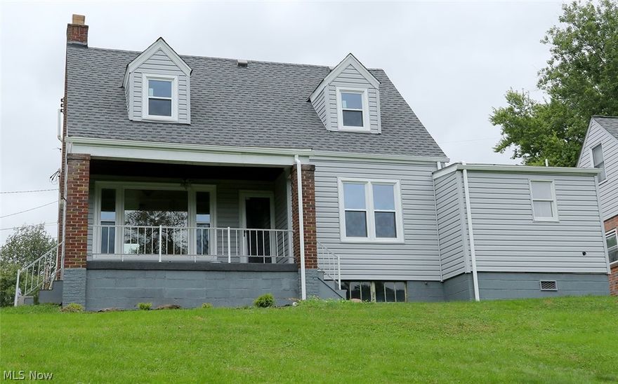 Completely remodeled home with tons of "new". New gas furnace, hot water tank, roof, siding, windows, plumbing, flooring, kitchen with all new cabinets and countertop, new bath on both floors, new garage door and opener, includes a radon gas system, wiring updated. Full basement with crawl space under first floor bath. Access to basement from both inside and out, one car garage, Beautiful view from back porch, close to Martins Ferry schools, hospital, shopping and highway. Ready to move right in.