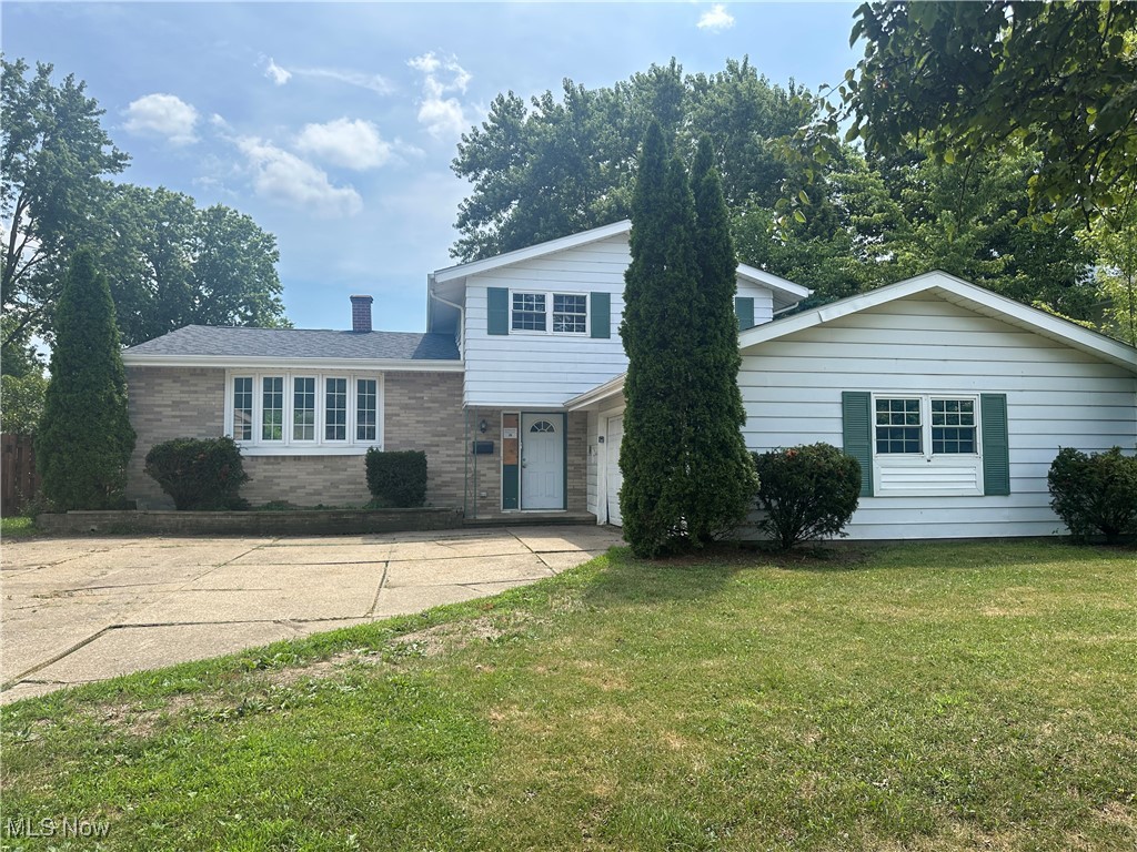 Rare opportunity in the heart of Berea! This split/multi level style home offers vaulted ceilings, some hardwood floors, large fenced backyard, partial basement for plenty of storage, newer hot water tank. Lots of light throughout. Double bay garage attached, concrete drive. Bathrooms on both down and up levels. Open and airy floorplan. Oak kitchen cabinets. Electric/boiler/baseboard heating. Property needs repairs/finish work. This property is made available to purchase with rehab loan or cash offers to owner occupants only the first 20 days on the market. All other offers will be open for submission after such time on the 21st day of being in MLS.