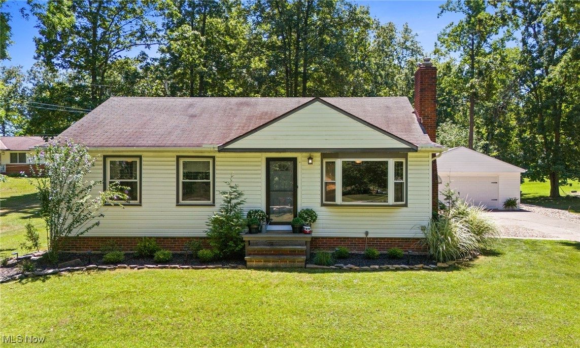 Experience the charm of country living in this beautifully updated ranch, perfectly set on 1.46 acres of peaceful, open land. Here, you’ll have the space to grow your dream garden, create a play area, host summer cookouts, or simply unwind as you take in the beauty of nature around you. Step in from the yard to a warm and welcoming kitchen, thoughtfully remodeled with shaker cabinets, updated countertops, modern lighting, refreshed flooring, and recently upgraded appliances—perfect for preparing meals while watching the seasons change through the windows. Inside, the home has been refreshed with updated flooring, soft neutral paint colors, and stylish lighting throughout. Three spacious bedrooms and a fully remodeled bathroom complete the main level. The partially finished basement offers a cozy family room for movie nights, a bar area for entertaining, and another room ideal for an office, craft space, or workout room. A convenient half bath, dedicated laundry area, and generous storage make this space as practical as it is inviting. Mechanical upgrades include a new central air conditioning system and a 2015 furnace for year-round comfort. Outside, enjoy evenings under the stars on the river rock patio, where decorative lights add a warm glow and the firepit invites you to linger just a little longer. The extended driveway leads to a refinished garage with epoxy floors, sealed walls, all-new electrical, and a heater—perfect for vehicles, a workshop, or extra storage. This home offers the best of both worlds—country tranquility with modern comfort. All this, while being just minutes from shopping and convenient transportation