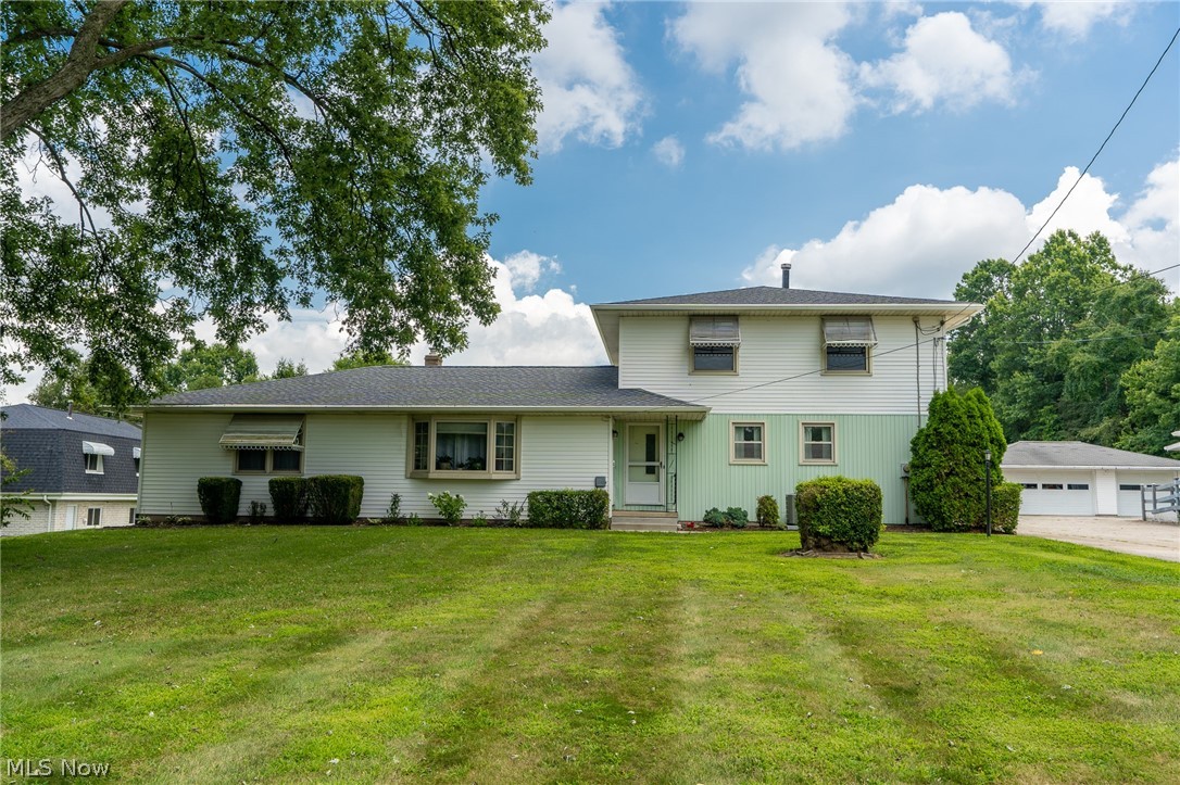 Wonderfully private and successfully rented for over 15 years. Family gem. This home is currently designed as a two unit. Top floor is 875 3 bed 1 bath 3rd bedroom used as laundry room with washer and dryer. Main floor unit is 1175 2 bed 1 bath with a utility room and washer and dryer. Basement and Garages, in addition to, a walk out balcony on the above unit, and a sun room on the main level unit. Both currently occupied and renting month to month at $800 each.