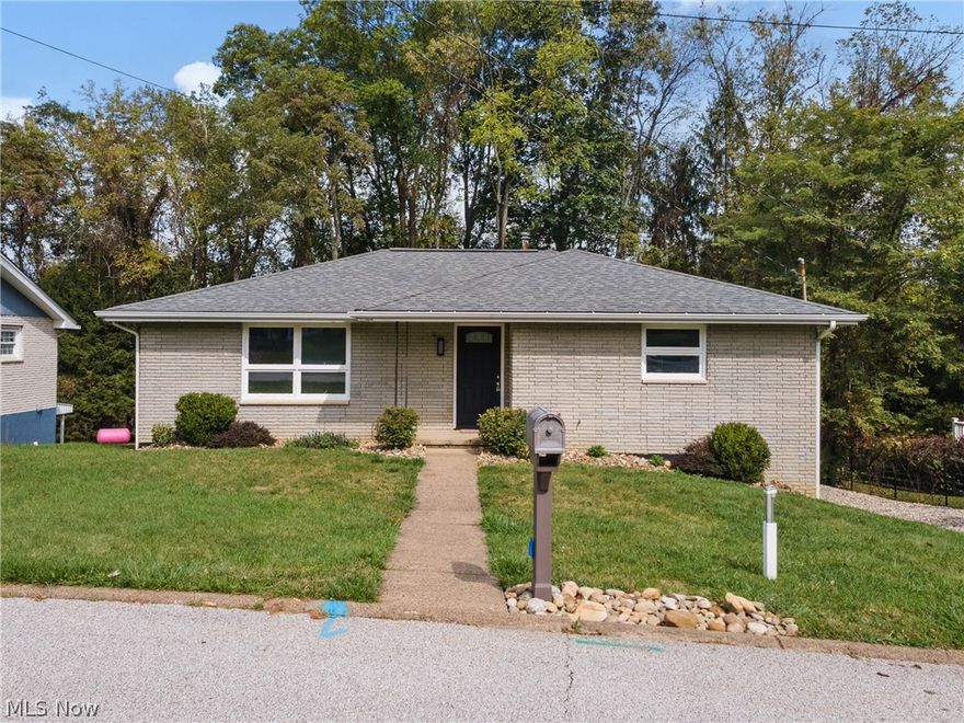 Welcome to 51235 Burrwood Dr, a fully renovated brick ranch tucked in a desirable St. Clairsville neighborhood—just outside city limits, so you’ll enjoy lower taxes while staying close to everything. This home combines modern updates with the charm of single-level living. Step inside to find a bright, open kitchen with brand-new cabinetry, sleek countertops, and stainless steel appliances. The entire home has been refreshed with stylish finishes, offering a clean, move-in ready feel. The built-in garage adds convenience and functionality, while the quiet setting provides a sense of space without sacrificing proximity to town. If you’ve been looking for a home that’s updated, practical, and perfectly located, this is the one.