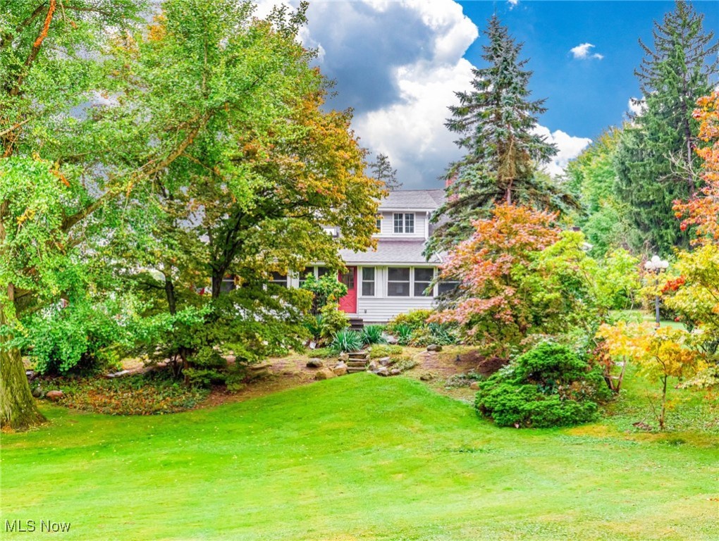 Don’t Miss This Rare Chesterland Opportunity! Being sold as-is – bring your vision and make it your own!
The dream lifestyle property—where you can live, grow, and earn—just became even more
affordable. Nestled on 10 versatile acres in the West Geauga School District (minutes from
Hawken School), this beautifully maintained 4-bedroom farmhouse blends timeless charm
with modern comforts. Inside, discover original woodwork, spacious living and family
rooms, first-floor laundry, a dedicated office, formal dining, and a charming covered front
porch—perfect for coffee or quiet evenings. Outdoors, enjoy a koi pond, stone fireplace,
and al fresco dining space—ideal for entertaining under the stars. There’s room to
homestead, garden, raise animals, or simply relax in privacy. Adding even more value: a
fully functioning income-producing duplex, with a 2-bedroom unit and a 1-bedroom
unit—each with full bath and private garage—perfect for extended family, caretakers, or
rental income. Extras include a 4-car detached garage, two outbuildings (including a former
racing pigeon loft with creative potential), and ample room for storage, workshops, or
hobby farming. Sold as-is, this unique property offers flexibility, charm, and income
potential—all in one. A rare opportunity to own a multi-functional lifestyle property in a
prime location!