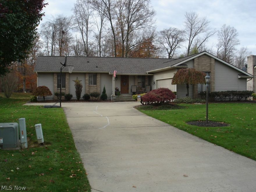 Outstanding 3 bedroom ranch with huge Great Room with vaulted ceiling. 28 x 15 with custom stone fireplace from floor to ceiling. Newer carpeting.  Kitchen 28 x 12 with all appliances. Master bedroom with master bath, rec room and 4th bedroom in basement with 3rd bathroom, plenty of closet space, 2 car attached garage, deck 20 x 16, backyard goes into woods, fire pit, newer shingles, 12 x 12 shed and much more.