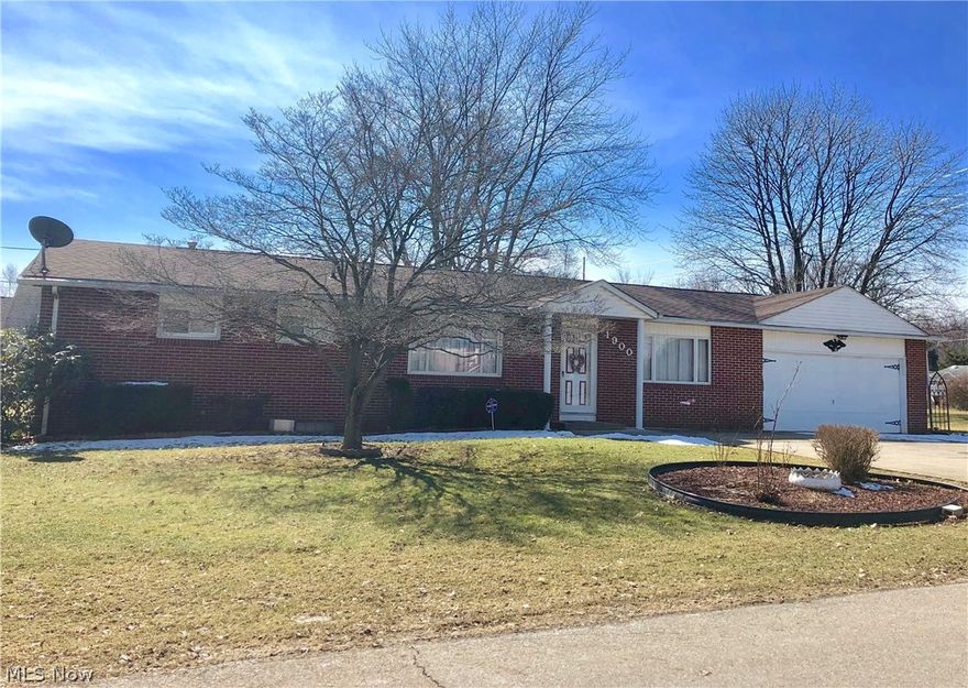 Quality brick & vinyl ranch home with over half acre lot!  Pride of ownership here with one floor living and 3 bedrooms.  Large kitchen with ceramic tile floor, plenty of dining space and appliances stay.  You'll love the park-like backyard with big covered deck and huge storage barn.  Partially finished Walk-Out basement with kitchenette, wood burner for heating purpose, half bath, family room, utility room w/shower and lots of storage.  Spacious living room and family room on first floor.  Updates include;  Roof 2008, updated furnace, sliding glass door and more.