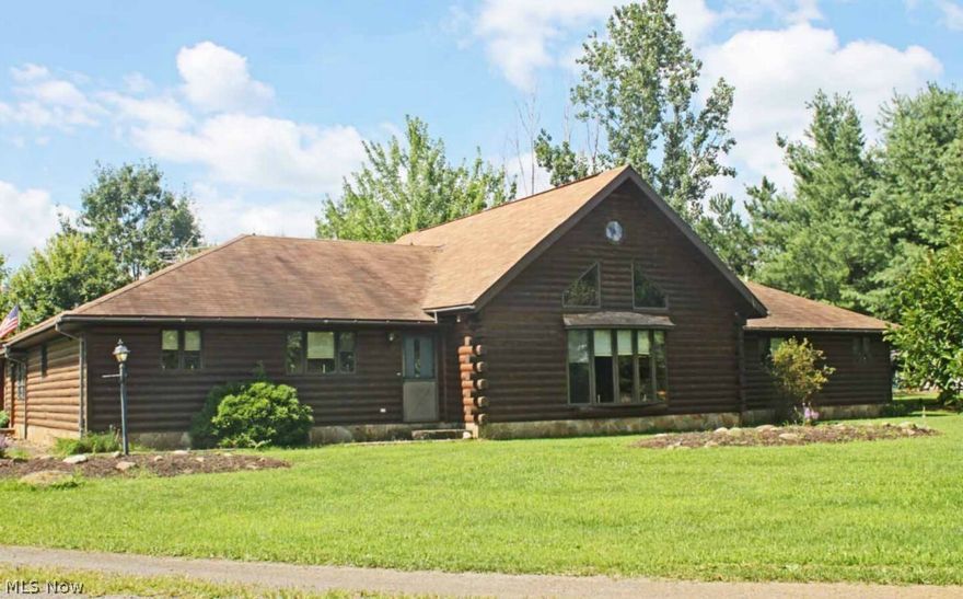 Log home built in 1992 - Approximately 2,472 sq. ft. - Features large open oak kitchen w/ center island - Dining area w/ hardwood floors - Huge great room w/ beam and cedar cathedral ceilings, stone fireplace, 5 bay window, rear sliding doors, HW floors underneath carpet - Master BR w/ double closet plus private bath w/ shower & hot tub - 2nd BR w/ large walk-in cedar closet - Full hall bath - Large utility room off kitchen w/ laundry, commode, plus attic access for storage - Breezeway/mudroom leads to 2-car attached garage - Gas hw heat plus air conditioning in part of home - Red 26x40 Gambrel barn w/ concrete floor, sliding doors & walk-up loft - Pond - Creek & beautiful 9 + acre lot - Fantastic setting - Selling for the trust - All mineral rights owned by seller transfer.
