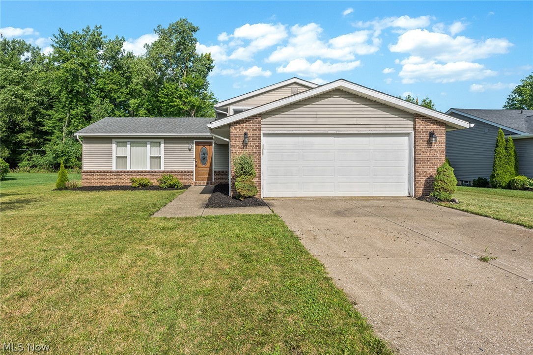 Welcome home to this spacious and updated 3 level split! When you walk in the front door, you'll love the vaulted ceilings, wood flooring and open floor plan. Enter the kitchen, and you won't want to leave- Extras include updated cabinetry, glass tile backsplash, granite counters and tile flooring. Plus, all of the stainless appliances remain as well! The family room is light and bright, and features a fireplace and there is also an updated half bathroom, laundry room and stairs to the garage. The upper level features 3 bedrooms and a remodeled bathroom- double vanity, tile flooring and tub surround. There is a huge backyard with a concrete patio for entertaining. The roof shingles were installed in 2016, Furnace and AC- 2011, updated electrical panel- 2017. Hurry and check out this winner today!