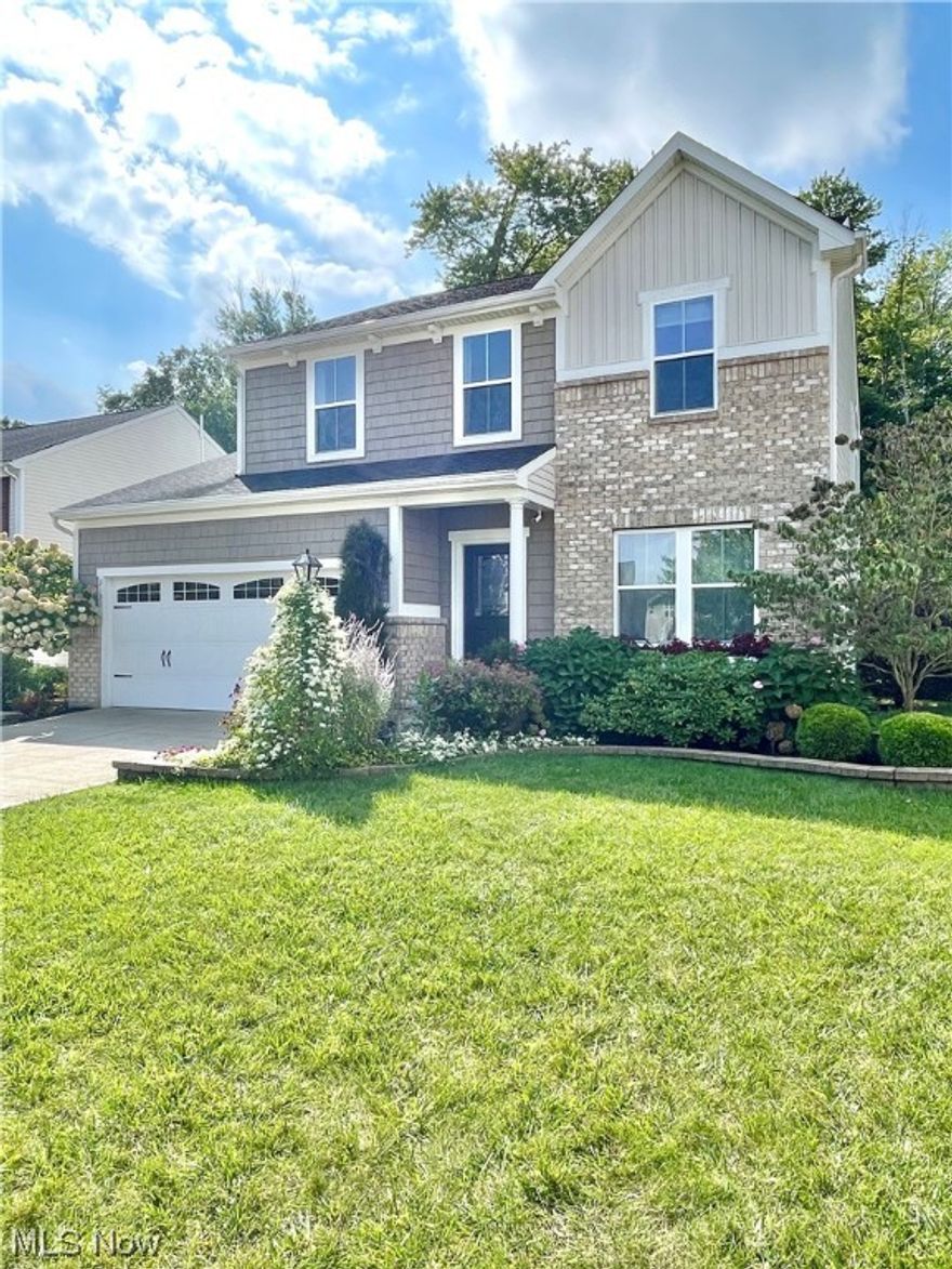 Nestled in the sought-after Shale Creek golf course community, this meticulously maintained, single owner colonial is on a cul-de-sac, with a wooded area behind the property. The covered front porch welcomes you to a den, then living room with an upgraded white cream kitchen to the left that has generous island space, vinyl plank flooring, stainless steel appliances, upgraded lighting fixtures, and pantry. This house also boasts a custom water filtration and softener system throughout the entire house, a $5,000 value. Off the kitchen is a sunny morning room with Crate & Barrel lighting. The upstairs has an open loft perfect for an office or rec room, 2 bedrooms, linen closet, and a master bedroom with walk-in closet and ensuite bath, with its own linen closet. The outside is a landscaping delight, with a paver patio partially enclosed with brick walls. There are 2.5 baths, first floor laundry, 9 foot ceilings downstairs, a full unfinished basement, and the house has upgraded white trim