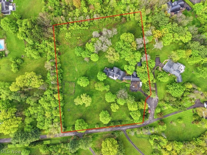 A truly rare offering in the heart of Geauga County, this breathtaking 4.49-acre property is the kind of land that rarely becomes available — a stunning blend of privacy, beauty, and location just walking distance to the charming Village of Chagrin Falls. Surrounded by picturesque scenery and mature landscape, this exceptional setting offers endless potential in one of Northeast Ohio’s most sought-after areas, within the highly acclaimed Chagrin Falls Exempted Village School District.
The 5-bedroom home presents an incredible opportunity for investors, builders, or buyers looking to restore or reimagine a prime piece of real estate. Please note: the home experienced a fire in 2022 and is being sold AS IS. The detached outbuilding did not experience fire damage and remains a valuable asset to the property.
For safety and liability purposes, agent must accompany all showings. Do not walk the property without prior agent permission. Property is under active video surveillance.
Owner is a licensed Realtor in the State of Ohio.