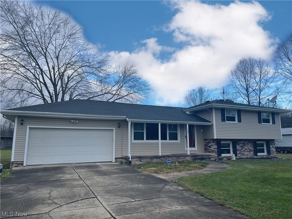 AWESOME 3 Level Split Level with AMAZING Outbuilding 38 x 49 Outbuilding on almost FIVE Acres of Land. First Floor: Home Offers a Large Living Room, Updated Kitchen, & Formal Dining Room. Second Floor offers a Large Master Bedroom with Updated Master Bath, 2 other Bedrooms, and 2nd Full Bath. The Lower Level offers a Large Family Room with Fireplace, Bonus Room or 4th Bedroom, and tons of Storage. The Basement has been updated with glass block windows, storage, & laundry room.
