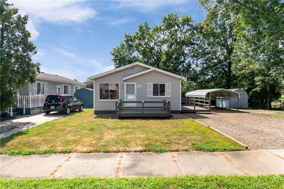Welcome home to 329 Broadview Ave in Barberton. This lovely ranch has much to offer. The home includes roughly 1000 square feet, three bedrooms and one full bath on a double lot. The floor plan is open and functional. The kitchen has been recently renovated featuring gorgeous granite countertops, new appliances, tasteful cabinetry and flooring. The kitchen adjoins to the cozy living room space including quality wood panelling along with a large window. Down the hallway are the bedrooms which are located at the back of the home. The master bedroom includes a spacious closet with built-ins. The two additional bedrooms are ample in size and share the full bathroom. The lower level offers tons of opportunity to be finished or plenty of storage. The exterior includes oversized carport, two spacious decks, firepit, double lot, shed, deadend street and abutting to a cemetery. Updates and features to hightlight on: vinyl windows, vinyl siding, carport, three car driveway, new flooring, new exterior doors, 100 amp electrical panel, HVAC 6-8 years old, roof 6-8 years old, and HWT good condition. This home is awaiting its new owner, make that you today!