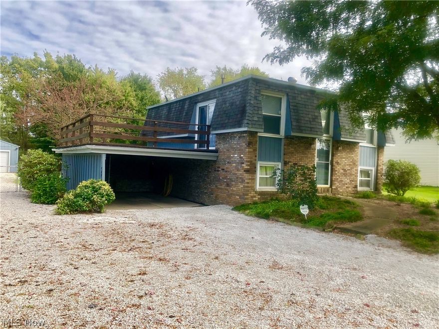 Well Maintained, Move in Ready, 3 Bedroom, 2 Bath Brick Bi-Level Home in Louisville. Home features include: an attached carport plus an additional 2 car detached garage with concrete floors and a new garage door with electric opener, fenced in backyard with an above ground pool, central air, gas furnace, replacement windows, security system, and a sliding glass door off the kitchen leading to a large deck over the carport. Lower level has been waterproofed by Ohio State Waterproofing. This home qualifies for 0% down financing through the USDA Rural Development loan program, ask your agent or loan officer for details and call for your private showing today!