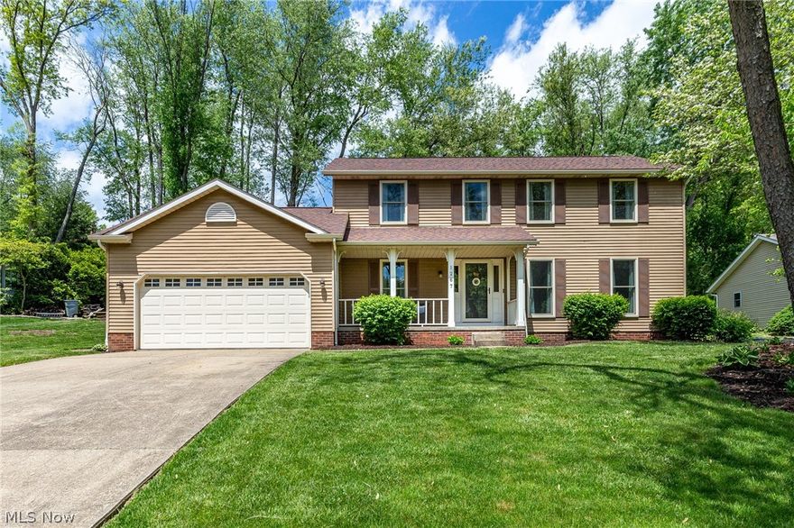 Here is your chance to own in one of the most desirable neighborhoods in Green! This center stair colonial, nestled into a friendly cul-de-sac is sure to please. The pride of ownership is evident from the moment you step into this well maintained home. A foyer and large living room greet you upon entering. The great room, complimented by beautiful ceiling beams and built ins flows right into the eat in kitchen. The marble countertops and hardwood floors in the kitchen accent the custom tile backsplash perfectly. Off of the kitchen you will find a formal dining room, powder room and a command center that leads right out to the back patio. The Primary Suite on the second level offers vaulted ceilings and a renovated bathroom with a custom tiled shower and walk in closet. Three additional bedrooms and a full bath complete the second floor. In the partially finished basement you will find a large rec room as well as a bonus room that is currently used as a 5th bedroom or easily used as an