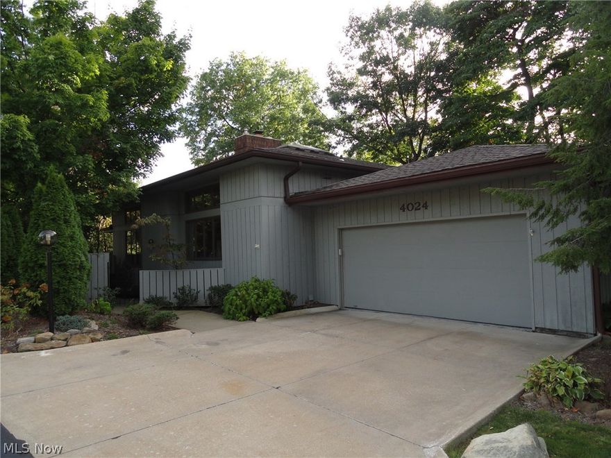 Spectacular "Kames" condo with desirable location overlooking the pond.  Unique open design with dramatic features that include a soaring beamed ceiling in the great room with windows across the back wall to view the serene setting.  All open to the formal dining and the bright kitchen with wood cabinets and black granite counters.  Master bedroom with vaulted ceiling, private deck porch and master bath with double sinks, granite counters, skylights & tile floor.  2 more bedrooms and a second full bath.  Huge basement with rec room & work shop area.  Two car attached garage & charming courtyard entrance.  The Kames has a community pool and clubhouse with full kitchen and seating area to host parties.   Convenient location.  Priced to sell!