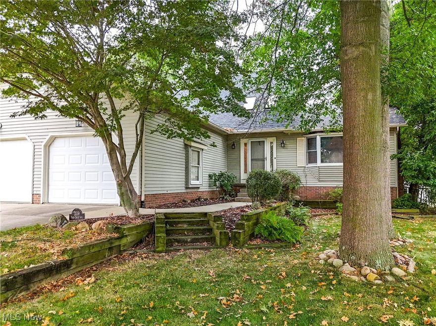 Welcome to 2119 Field Circle Avenue, a beautiful 3 bedroom, 4 bathroom home located on a quiet cut-de-sac in the serene neighborhood of Ellet. With 1800 sq. ft. of living space, this home offers the perfect blend of comfort, convenience, and modern living.  Relax in the spacious first floor owners suite, complete with a walk in closet, fireplace, and a tastefully updated private ensuite bathroom. The second story is home to two additional bedrooms, a full bathroom and a small loft area. The kitchen features updated stainless steel appliances, granite countertops and ample cabinet space for all of your culinary needs. Enjoy the open and airy living room with wood burning fireplace (gas log starter) and plush new carpet. The French doors off the owner's suite leads to a 3 season enclosed patio with skylights. A sliding glass door off the kitchen leads to a deck with a built in Kamado Joe ceramic cooker and a relaxing hot tub overlooking the private back yard. The lower level family room with a custom bar, fireplace and half bath will be a favorite spot to entertain family and friends. The lower level also has a laundry area with a stationary tub and the newer washer and dryer stay for your convenience. Updates include; New roof (2024), New garage doors (2024), New carpet (2024) New flooring, vanity, lighting, shower door in ensuite bathroom (2024). You will not want to miss this home, it will not last long. Call today for your private showing.