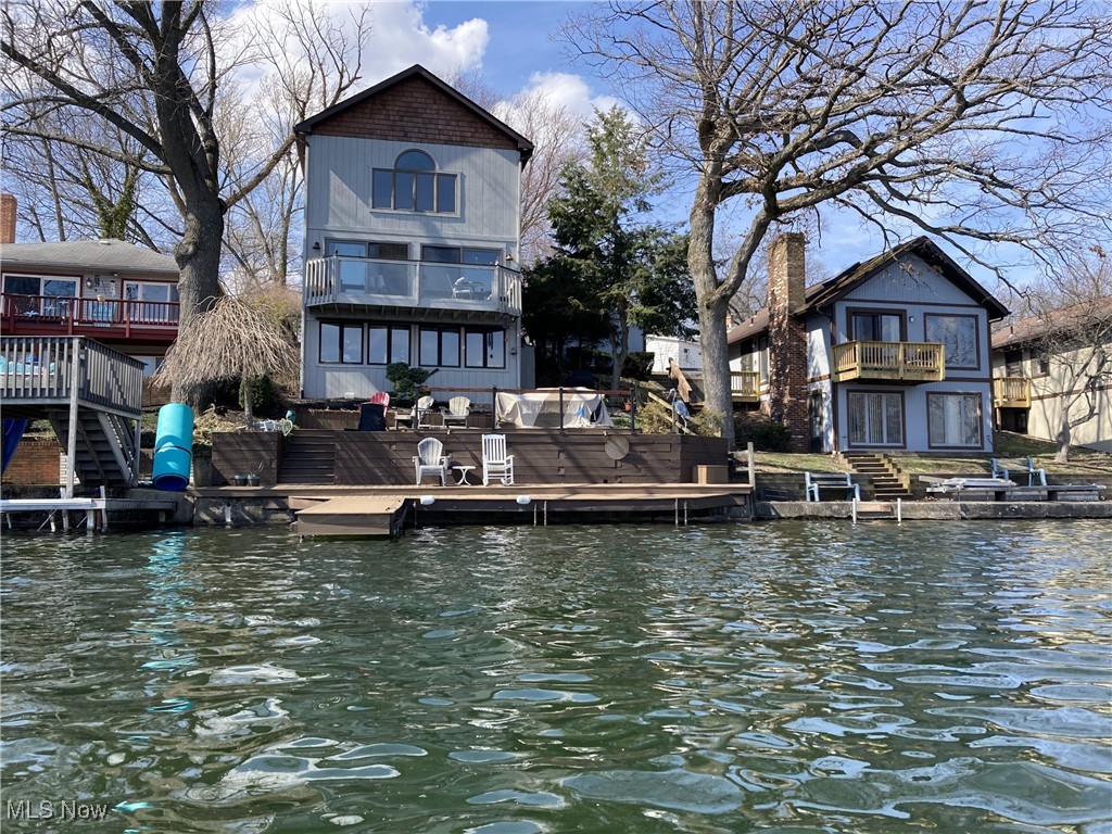 Exceptionally Beautiful Home with an attached 2-car garage awaits on "Portage Lakes Main Chain" You can Enjoy a "Portage Lakes Lifestyle" w/ Lakefront decking and Large Boat Dock, simply perfect for boating, fishing, skiing & more. The vaulted living room features sliders to a spacious lakefront balcony with superb views. A huge family room loft with a gas fireplace and a lovely lake view has potential as a jumbo 4th bedroom with two roomy closets. The cozy Master suite includes a walk-in closet and a Master Bath with a large jetted tub, walk-in shower, and heated light/fan. A large second bedroom with a like-new full bath provides the option for a second master suite. The home also includes smart lighting and speakers, a fully applianced kitchen with granite countertops, and a charming dining area with spectacular lakefront views. Beautiful composite decking and a multi-faceted boat dock require minimal maintenance, giving you more time to enjoy your lakefront home. Lovely landscaping completes this amazing property.