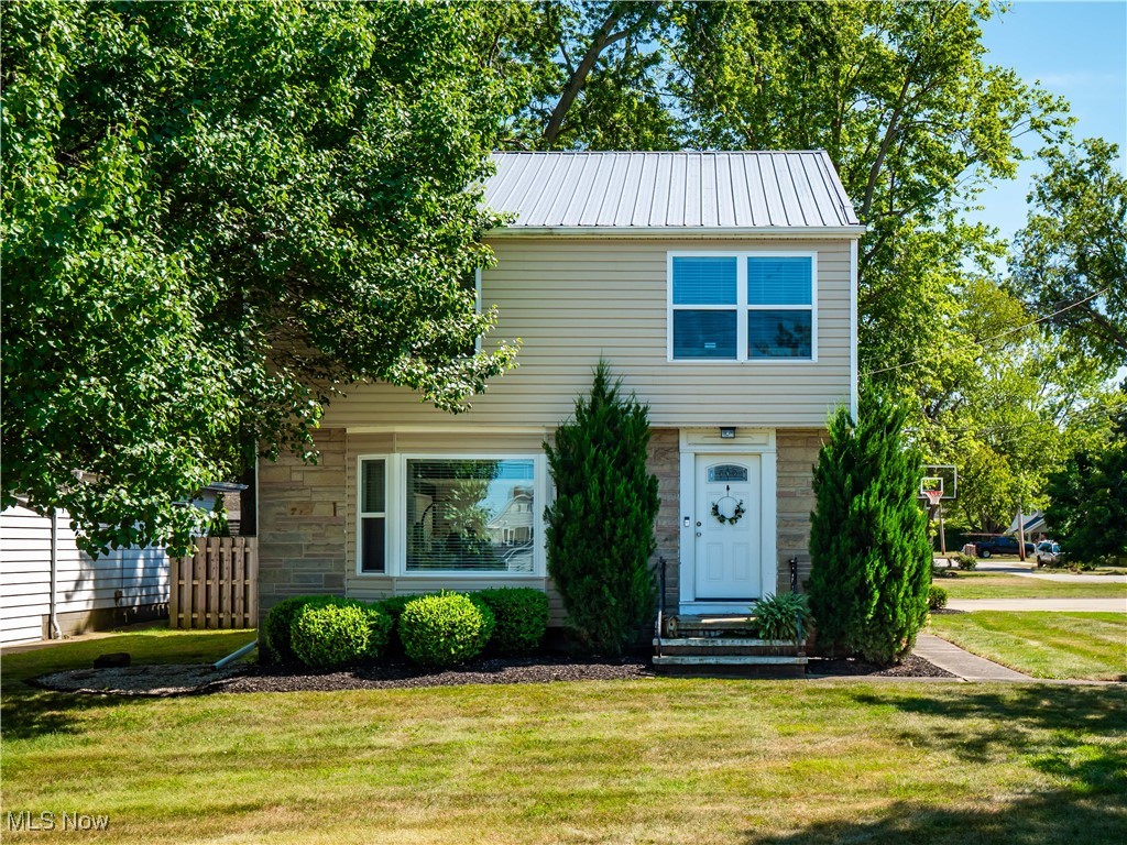 It's your lucky day! House back on the market due to no fault of the seller. Step inside and feel instantly embraced by warmth and character of this house. This charming home features rich dark hardwood floors, moody designer paint colors, and a peekaboo view of Lake Erie that adds to the inviting ambiance. Natural light pours in from every angle, enhancing the cozy feel throughout. It is an open floorplan making the main level space very cohesive and the added convenience of a half-bath on the main level. The updated kitchen—completed by previous owners—boasts timeless off-white cabinetry and stunning granite countertops. The finished basement offers additional living space with a recreation area perfect for relaxing or entertaining and laundry/storage space. Upstairs, you'll find all three bedrooms with closet organizers, plus a walk-up attic that offers the potential for extra storage with the addition of flooring. Outside, enjoy two freshly painted side porches—one featuring a pergola, string lights, and curtains for your own private retreat, and relax in the yard by the firepit on those fall nights. The fully fenced yard adds privacy, and the attached two-car garage includes an additional storage shed for all your extras. For just $80 annually, homeowners can enjoy private beach access at Vineyard Beech—an ideal bonus for lake lovers.There is a metal roof for a longer lifespan than a regular roof.