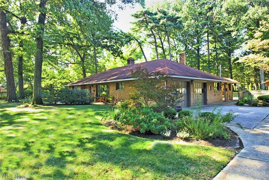 This sprawling ranch home with 2 bedrooms, an office/bonus room and 2 full baths features 2,400 square feet and sits on a ¾ acre wooded lot. Every surface of this home has been improved with new custom bathrooms and new floors and paint throughout. The kitchen and bathrooms are top of the line, with the kitchen featuring a Sub-Zero fridge, Miele appliances including an induction cooktop (superior to electric and gas), Bosch dishwasher, 128-bottle wine fridge, convection microwave (which gives you dual-oven capabilities) and soft-close cabinets. One bathroom is outfitted with dual shower heads and an oversized soaking tub for two. The other features a Kohler digital shower system to tune the temperature to the precise degree you prefer. This home also features original radiant-heat flooring, a family room with pool table, a large dining room and sitting room, new laundry room, and new mudroom directly accessible from the attached two-car garage. The backyard is fully fenced and features