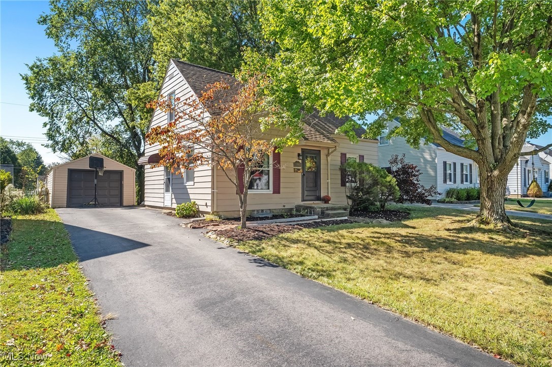 This incredible home is located just minutes from downtown Cuyahoga Falls, close to restaurants, shopping and entertainment. Main level features gleaming hardwood floors, large living room and a fully applianced, crisp white kitchen! Just off the kitchen is a dining room that could easily double a family room or office. Two sizable bedrooms and an updated full bathroom complete this level. Upstairs you will find a third bedroom with a large closet and a sitting room. Lower level has been finished to include a recreation room and music room! As an added bonus all the appliances, including washer and dryer will convey. Exterior features include a large back deck overlooking the private back yard, brick patio with pergola and a garage! Notable improvements include roof replacement , updated windows, new flooring in bathroom and dining room, new carpet on second level, new sliding door and updated HWT. Don't miss an opportunity to tour this adorable home.