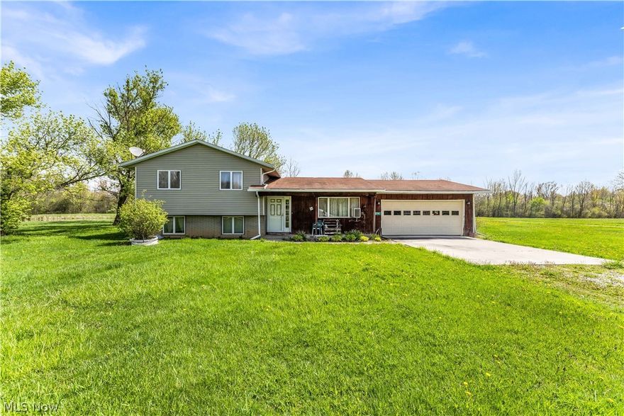 3 bedroom 2 full bath home on over 5 acres of beautiful land. House has 2 car attached garage with a new garage door. Large eat in kitchen with a sliding door to the back patio that is less than 10 years old. Home has 2 living areas with partially finished basement with windows all around allowing lots of natural light in. Front patio put in less than 10 years ago; perfect to sit out on and enjoy a cup of coffee in the morning. 5 acres has a beautiful bond on it. 40 x 32 barn with concrete flooring & electric. Great location, right on US RT 20. Must see!!