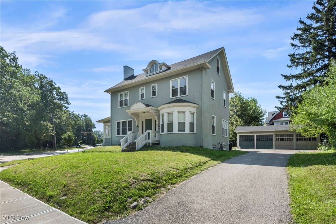 Immediate occupancy awaits in this elegant, newly expertly refinished century Colonial offering over 3,000 sq ft of living space across three finished levels with 5 bedrooms, 3.5 baths & full basement perched on a beautiful lot in a nicely treed quiet location. Updated for modern living and POS compliant, home features a newly refinished exterior, updated HVAC w/central air, numerous mechanical upgrades for years of worry-free comfort. Situated in a quiet, desirable location, property fronts Cleveland Heights’ urban oasis—Cain Park—offering year-round recreation, from summer concerts and art fairs to winter sledding, plus playgrounds. First floor boasts a classic center hall layout with modern flow, sun-filled open rooms, a lovely fireplace, enclosed sun porch, & bonus room ideal for an office or lounge. Remodeled kitchen, open to the dining room, blends elegance w/a contemporary feel. Upstairs, discover five true bedrooms—including one with a romantic fireplace—plus a 3rd-floor studio perfect for teens, artists, or guests. Large basement w/additional bath offers excellent storage and finishing potential. Updated windows & blinds enhance the home’s timeless character. Convenient 2-car garage (shared wall with neighbor’s garage), large driveway for 4+ cars, and ample street parking add convenience. Affordable, move-in ready, and filled with charm—this is the best buy in Cleveland Heights. Welcome home!