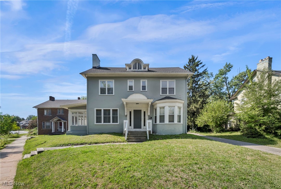 Immediate occupancy awaits in this elegant, newly expertly refinished century Colonial offering over 3,000 sq ft of living space across three finished levels with 5 bedrooms, 3.5 baths & full basement perched on a beautiful lot in a nicely treed quiet location. Updated for modern living and POS compliant, home features a newly refinished exterior, updated HVAC w/central air, numerous mechanical upgrades for years of worry-free comfort. Situated in a quiet, desirable location, property fronts Cleveland Heights’ urban oasis—Cain Park—offering year-round recreation, from summer concerts and art fairs to winter sledding, plus playgrounds. First floor boasts a classic center hall layout with modern flow, sun-filled open rooms, a lovely fireplace, enclosed sun porch, & bonus room ideal for an office or lounge. Remodeled kitchen, open to the dining room, blends elegance w/a contemporary feel. Upstairs, discover five true bedrooms—including one with a romantic fireplace—plus a 3rd-floor studio perfect for teens, artists, or guests. Large basement w/additional bath offers excellent storage and finishing potential. Updated windows & blinds enhance the home’s timeless character. Convenient 2-car garage (shared wall with neighbor’s garage), large driveway for 4+ cars, and ample street parking add convenience. Affordable, move-in ready, and filled with charm—this is the best buy in Cleveland Heights. Welcome home!