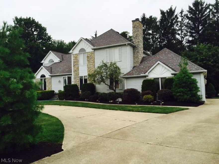 Discover a 4BR+bonus 5th LL BR in a stately, flowing, expansive home that has much more than meets the eye! Uncontested curb appeal and desirable turnaround drive. Edenic landscaping with fortress-worthy fencing. Well-dimensioned exterior that superbly blends stone, wood and vinyl materials. Formal oversized 2 story foyer with lengthy catwalk balcony that oversees all 1st Flr festivities. Arched entry way into a dramatically vaulted parlor, formal dining room, expansive eat in kitchen with double doors to oversized deck whose lush landscape provides a serene setting. Mammoth FAM RM with stately stone WBFP adjoins kitchen. 1st Flr office currently being modified to include closet, and adjoins half bath wall if 1st Flr Ste desired. Convenient laundry off attached garage. Level 2 features 3 additional BRs, 2 with vaulted ceilings. Ritz Carlton-caliber Master Suite with WBFP, California Closets, Personal Valet Clothing System and indulgent bathing amenities will make coming home a privileg