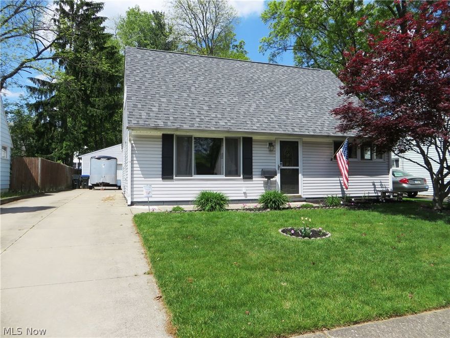 Welcome home to this move in ready Cape Cod. Featuring 3 bedrooms 2 full bathrooms and formal dining room! Kitchen has been updated with newer stainless steel appliances that stay! Newer carpeting and paint in living and dining rooms. The open staircase connects the home and gives it a more spacious and open feel! Utility closet is off kitchen and includes a tank less water heater and washer and dryer that will stay. Back yard is great for entertaining with deck and newer stained concrete patio and gas grill with direct hook up. Over sized 2 car garage and paved drive. Other updates include roof, siding, electric panel and furnace. Call today for more information! Seller providing a one year home warranty.