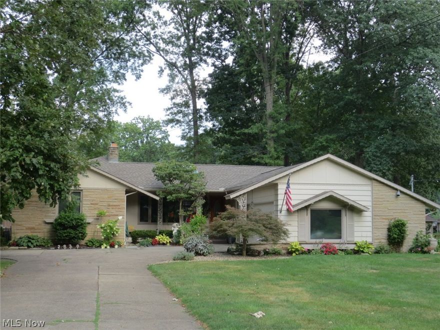 A rare find!  Look at this custom Howland ranch with 3 bedrooms, 2 -1/2 baths, and large rooms with hardwood floors throughout;  a gorgeous 4-Season room addition overlooks the park-like backyard and french doors open onto a deck (with privacy lattice and recessed exterior lighting);  the large living room has a gas fireplace (with blower) and a skylight; the cheerful kitchen has a lovely bay window in the breakfast area and there is a formal dining room; there are Anderson replacement windows throughout;  the master bedroom has its own bath with marble shower and three cedar closets; the huge basement boasts a family room with woodburning fireplace, a rec room with pool table and another room for storage (as well as a half-bath) and glass block windows.  The yard is extensively landscaped with attention to detail (even a lawn sprinkler).  Seller is including a home warranty.  Immediate possession.