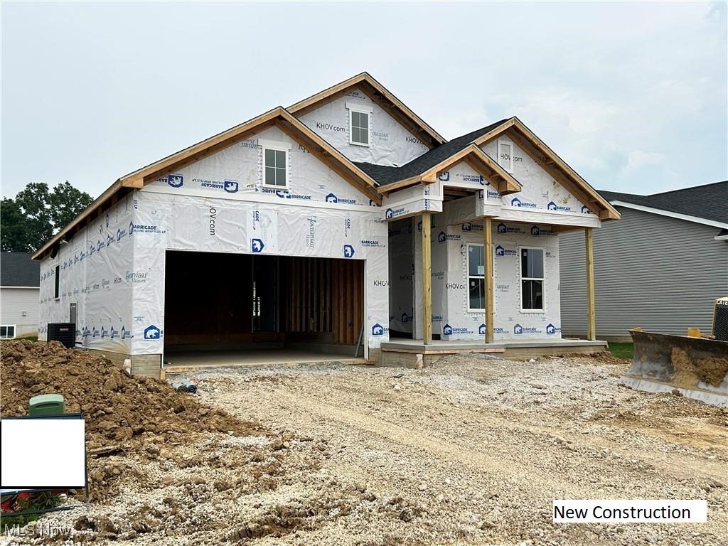 Imagine coming home to Heritage Park, where timeless design meets effortless one-level living. You step into a grand foyer with a tray ceiling and elegant millwork—light pours in through oversized 6’ windows, reflecting off 10’ ceilings and 8’ doors that give the entire home a bright, open feel. Your eye is drawn to the heart of the home: a chef’s kitchen with rich, dark-stained cabinets, ceiling-height backsplash, under-cabinet lighting, and stunning Calacatta Abrezzo quartz countertops. Just beyond, the defined dining area is wrapped in windows and finished with a statement chandelier. In the great room, vaulted ceilings and a gas fireplace invite you to relax. Step outside to your covered rear deck, and flat yard stretching 53 feet—ideal for summer evenings and fall bonfires. You retreat to your primary suite, where a tray ceiling, custom millwork, and a soft chandelier create a sense of calm and comfort. You slip into the freestanding tub and let the day melt away—this space is yours to unwind and recharge. Every detail in this “Classic Look” design evokes understated elegance. With front and rear sprinklers, low-maintenance landscaping and snow removal for a low monthly fee, life here is beautifully simple. Knowing this community is already 75% sold out, with only three Asheville homes remaining, you don’t waste any time waiting for the home’s completion. You eagerly put in an offer today knowing you will be the one moving in by the end of September.