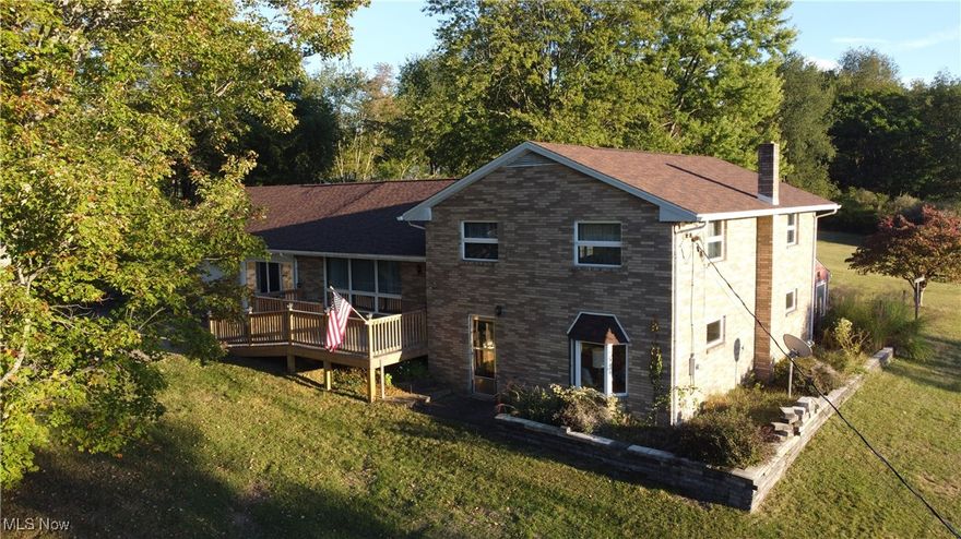 This tri-level, 3-bedroom home rests on 3.26 beautifully laid country acres, offering peace and privacy with easy access to Pittsburgh, Weirton, and surrounding areas.  The main level features a spacious living room with a charming brick accent wall, while the well-designed kitchen offers abundant honey oak cabinetry, Solid surface countertops, a snack bar, and a built-in desk. From the dining area, step into the bright sunroom—perfect for relaxing on warm days and quiet evenings while enjoying views of the peaceful backyard. The primary bedroom includes a private bath with a Walk-in shower, a stylish vanity, and a convenient stackable washer/dryer. Two additional bedrooms with large closets are located near the main bath.  On the lower level, you’ll find a welcoming Family room with a bay window w/built-in storage beneath, a wood-burning stove, & additional cabinetry w/ countertop space—ideal for entertaining or unwinding. A large closet houses a metal safe that stays with the home. The laundry room includes a half bath & walkout access to the backyard. The basement holds the electric furnace/AC, hot water tank, water softener, and ample storage.  A breezeway off the kitchen opens to the outdoors or leads to the oversized 2-car garage.
This inviting home is ready for you to enjoy the tranquility of country living with the convenience of nearby city access.