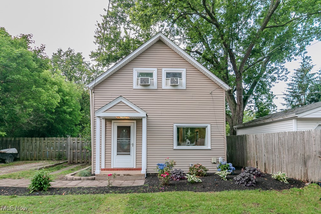 Step into the charm of yesteryear with the comforts of today in this beautifully updated three-bedroom Cape Cod! Built in 1920 but thoughtfully refreshed throughout, this home features a modern kitchen, updated bathroom, and new flooring—making it truly move-in ready. The main level offers a bright and functional living room with overhead lighting and stylish laminate floors. A flexible dining area can easily double as a home office or study space. The updated kitchen includes all appliances, a sleek subway tile backsplash, and convenient access to the backyard through sliding glass doors. Step outside to your private, fully fenced backyard—complete with a deck, storage shed, and plenty of space to relax, entertain, or grill to your heart’s content. The main floor is completed by a spacious full bathroom, a pantry, and basement access where you’ll find the laundry area. Upstairs, all three bedrooms await. Two feature easy-care laminate flooring, while the primary bedroom showcases original hardwood floors, a walk-in closet, and enough room for a sitting area or desk. To top it all off, the seller is including a one-year home warranty for peace of mind. Don’t miss your chance to own this charming and updated home—schedule your visit today!